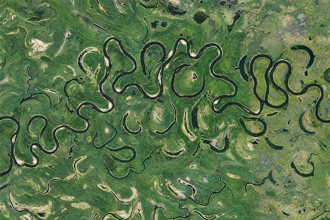 A river meandering across its floodplain, from above